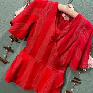 Pretty red blouse with small white thread details
